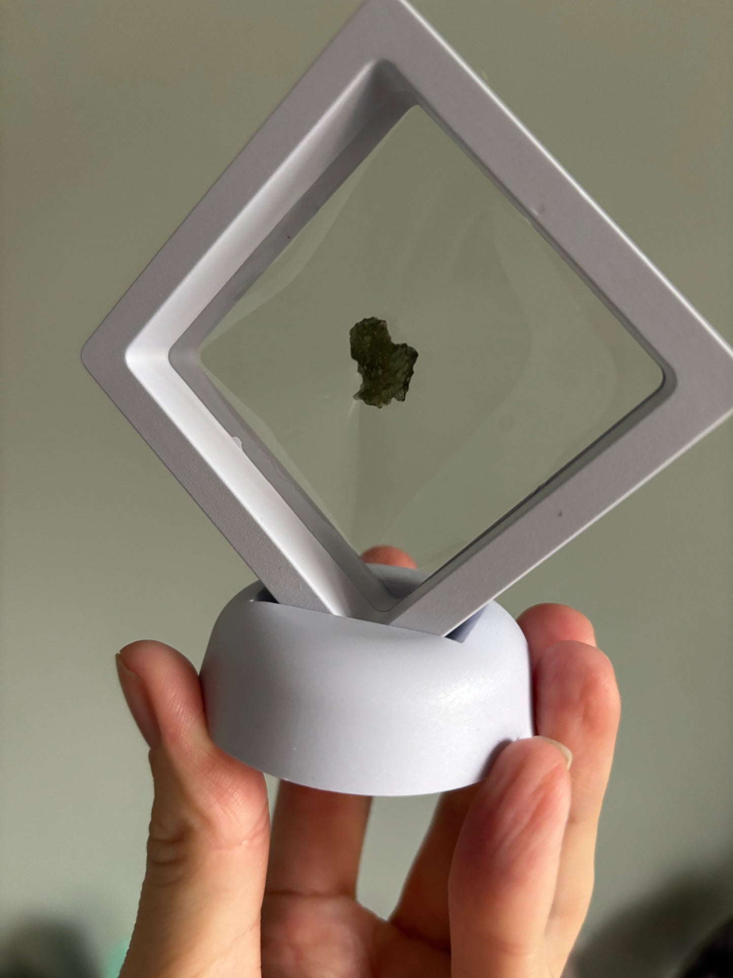 Moldavite in display case