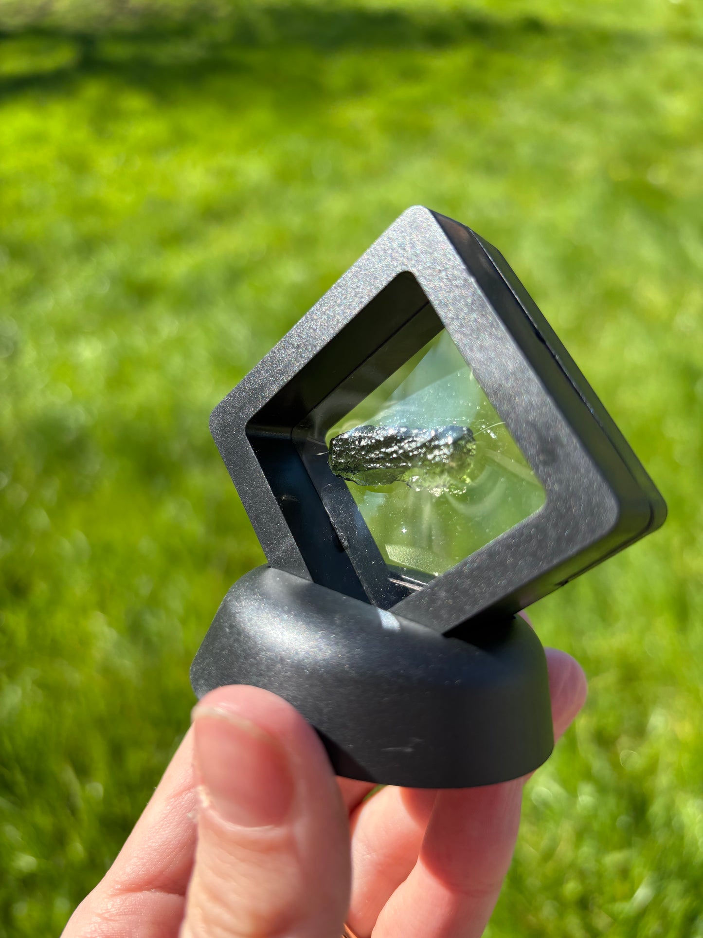 Moldavite in display case 2grams