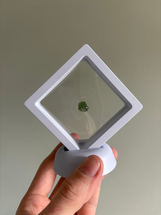 Moldavite in display case