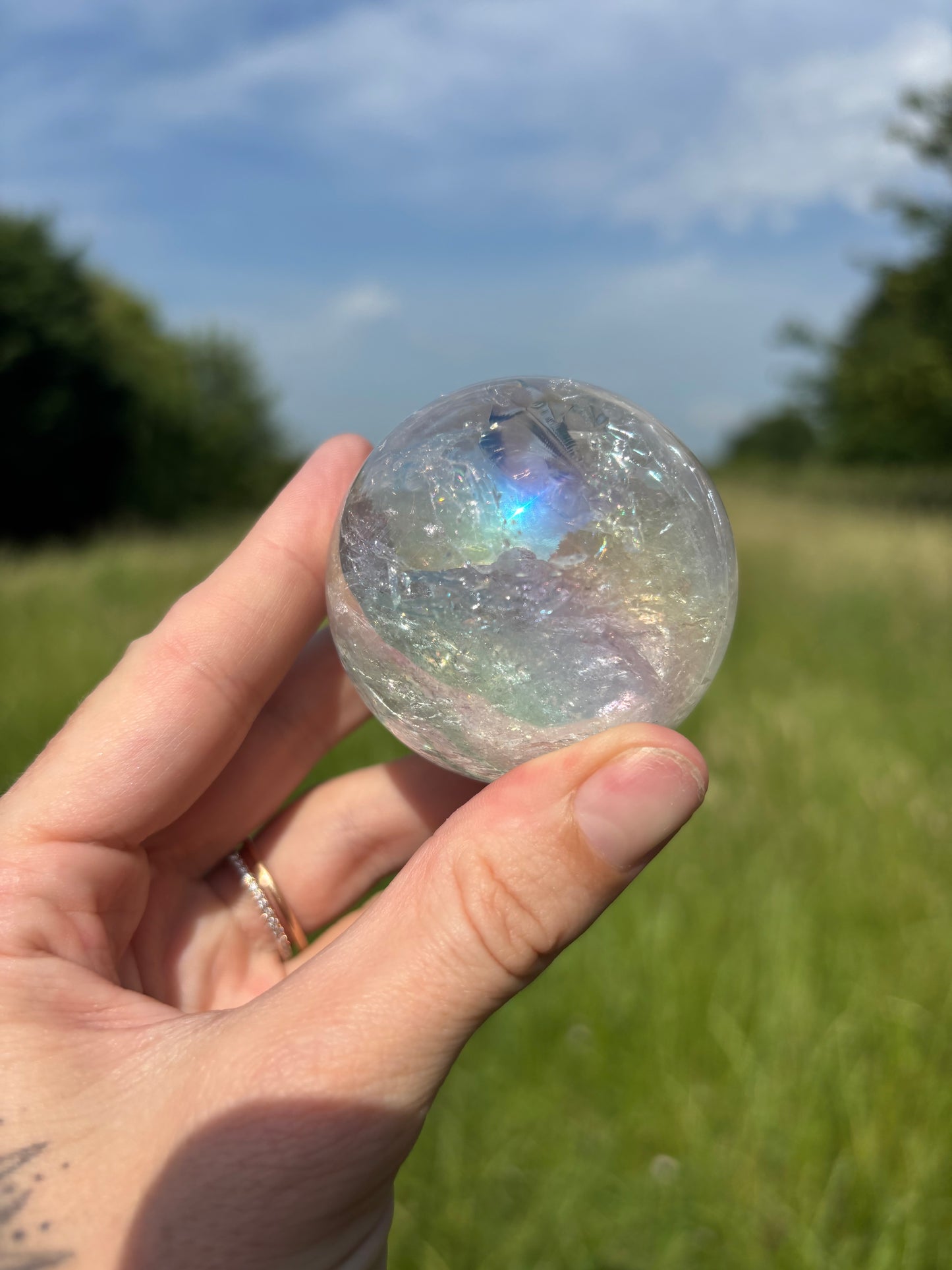 Aura clear quartz sphere