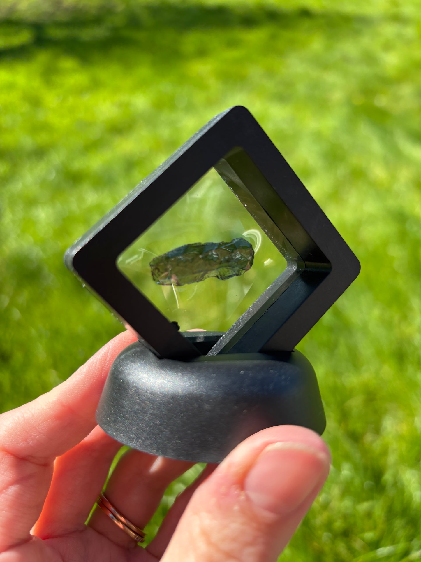 Moldavite in display case 2grams