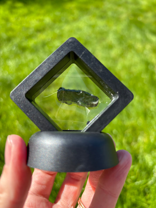Moldavite in display case 2grams