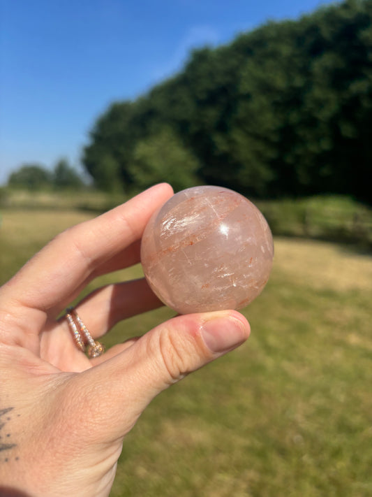 Rose quartz and fire quartz sphere